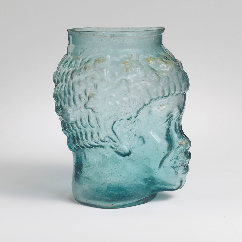 Glass cup in the form of the head of a Black African