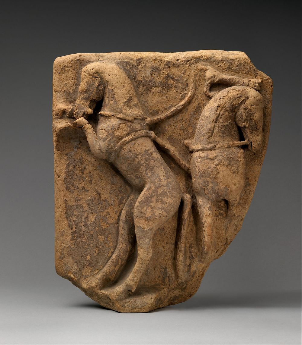 Fragment of a terracotta relief with two horses