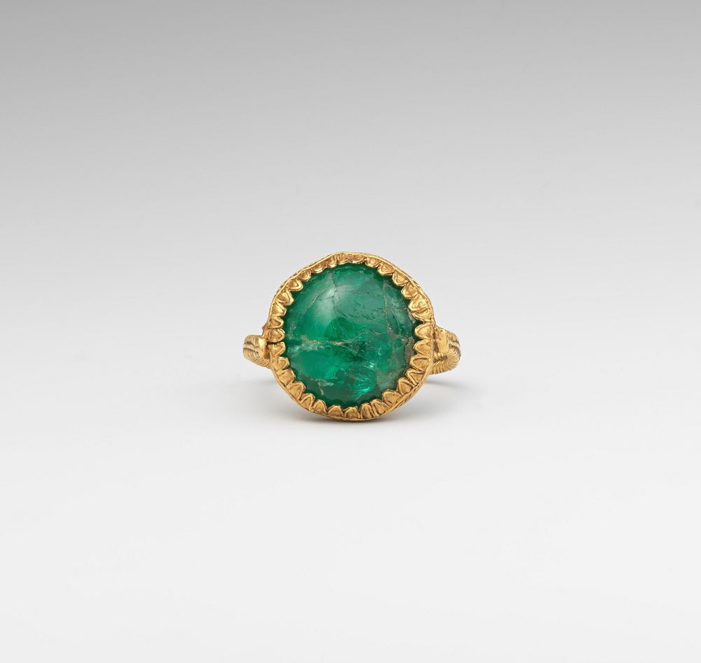 Gold ring set with an emerald