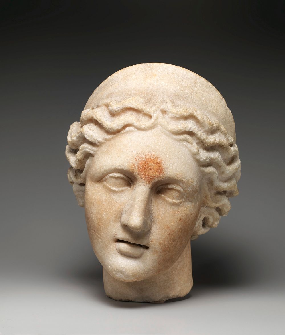 Marble head of a goddess wearing a diadem