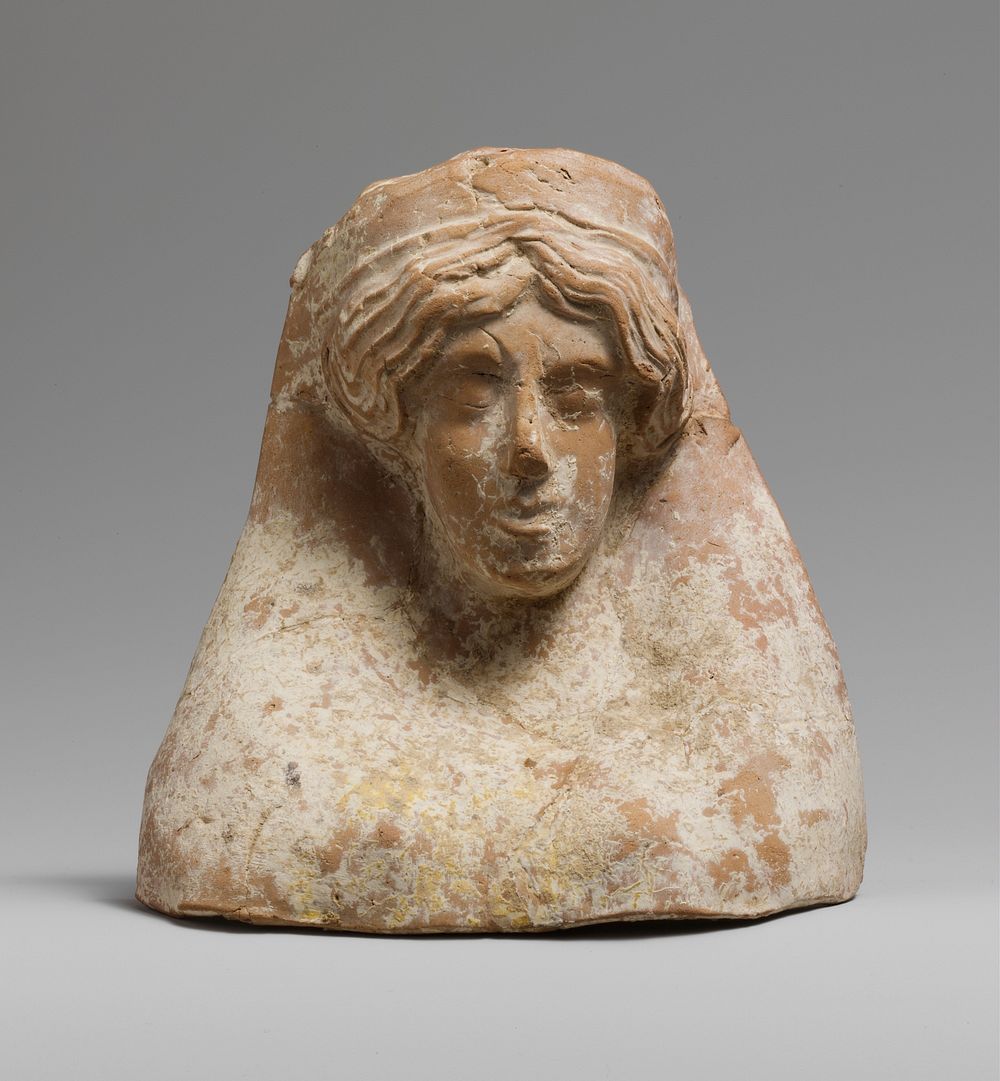 Terracotta relief with the head of a woman