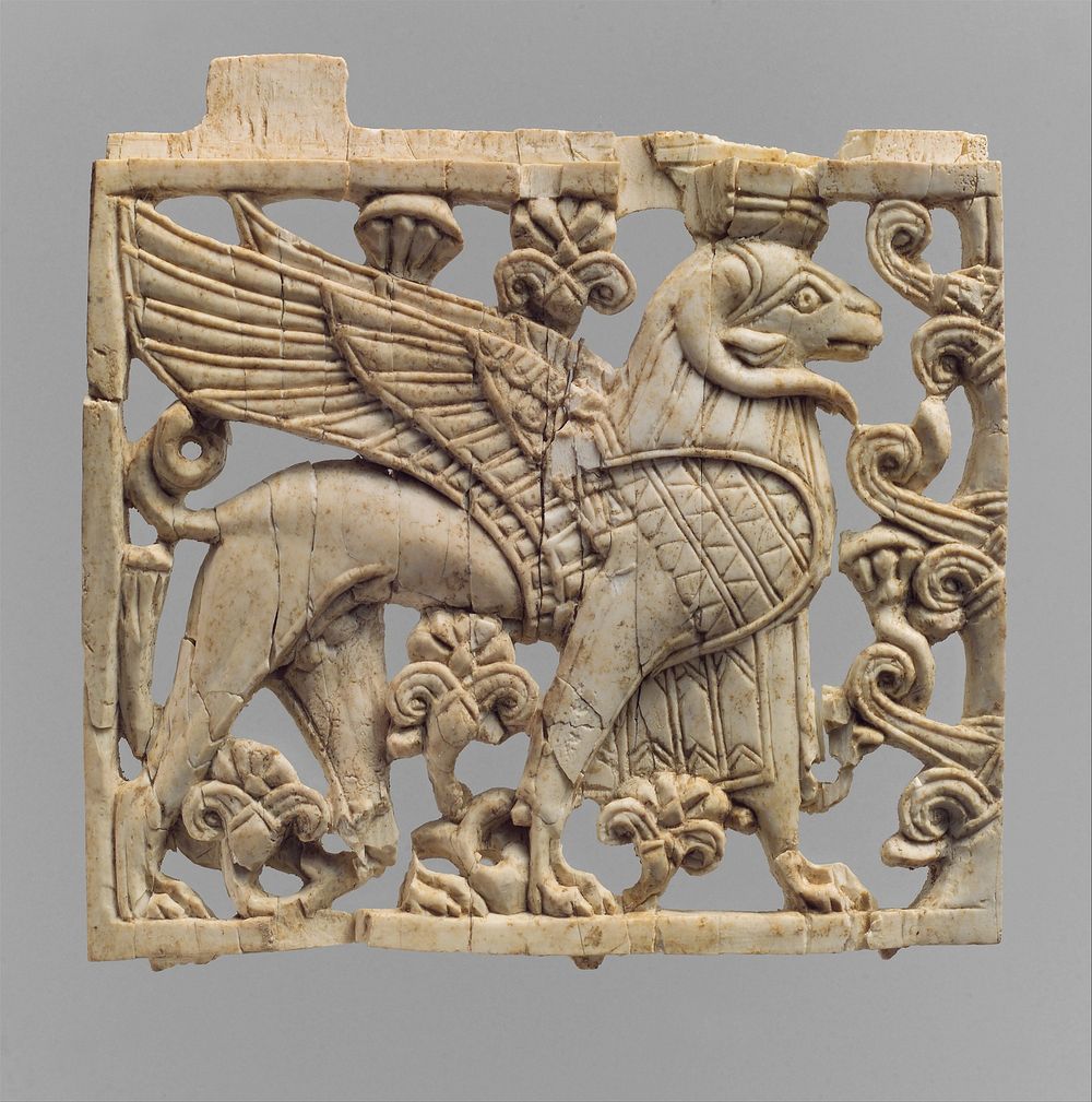 Openwork furniture plaque with a striding, ram-headed sphinx