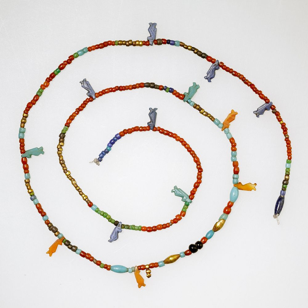 String of tiny disk beads, barrels, and 13 Taweret amulets