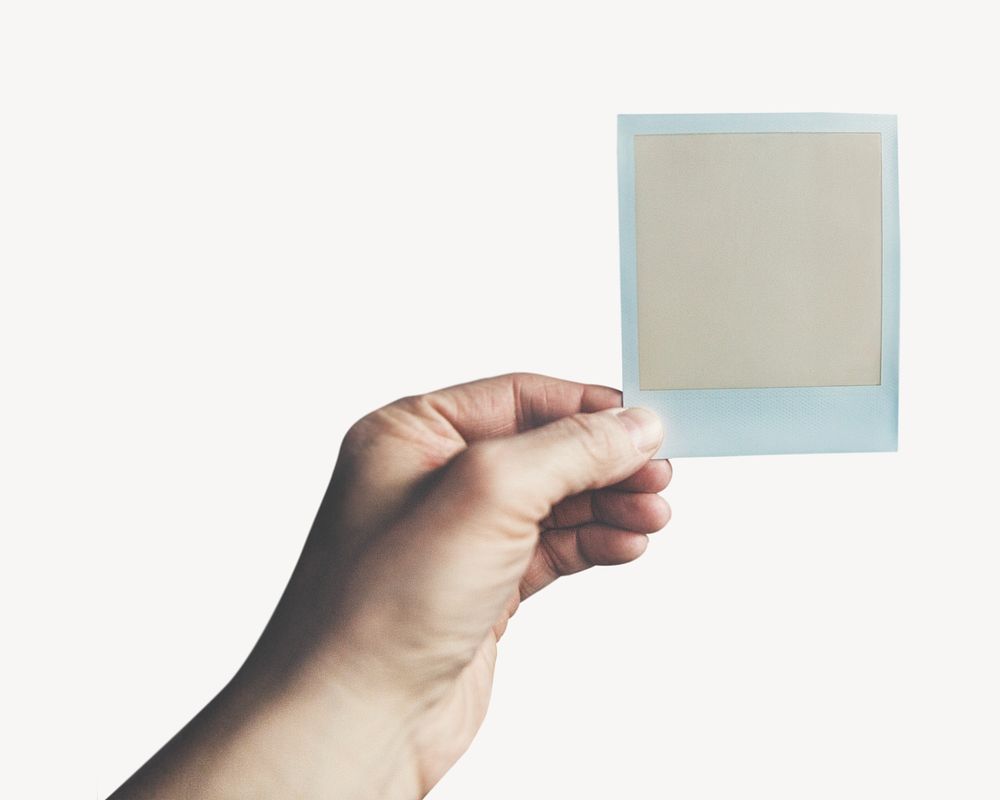Person holding an instant photo image