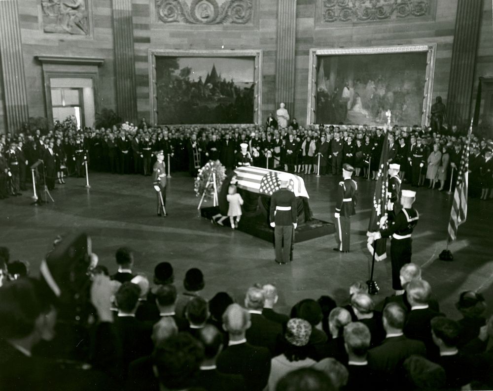John F. Kennedy Lying in State November 24, 1963Mrs. Kennedy and daughter, Caroline Kennedy, kneel at the catafalque with…