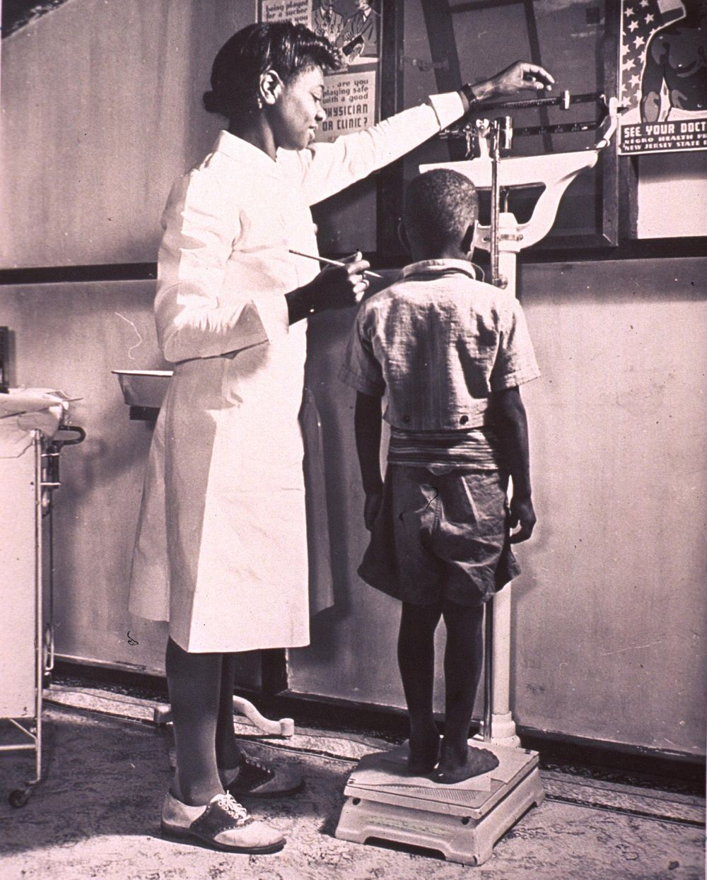 Nurse weighing childContributor(s): United States. Federal Security Agency. Original public domain image from Flickr