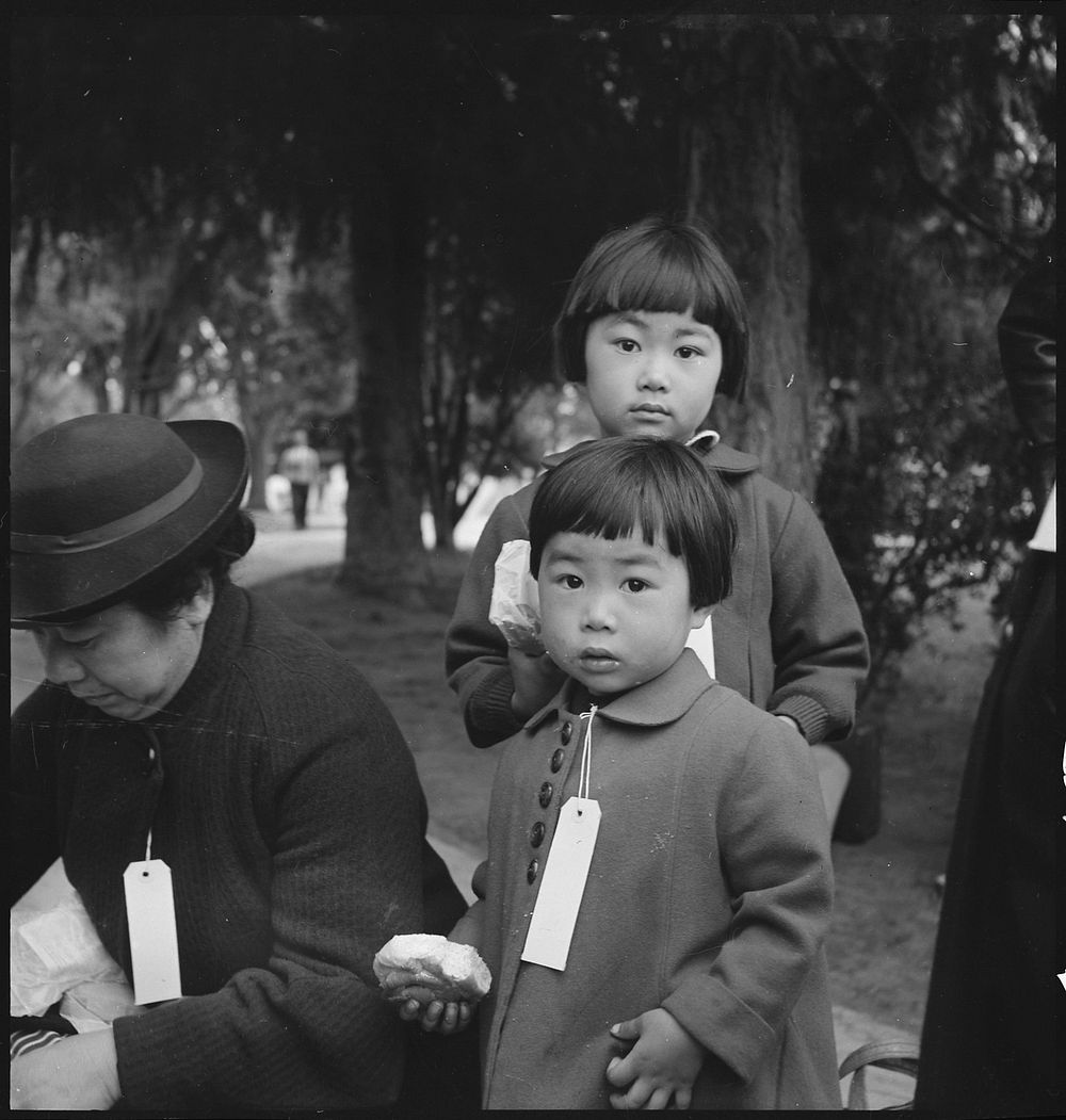 Two Children of the Mochida Family, with Their Parents, Awaiting Evacuation Bus. Original public domain image from Flickr