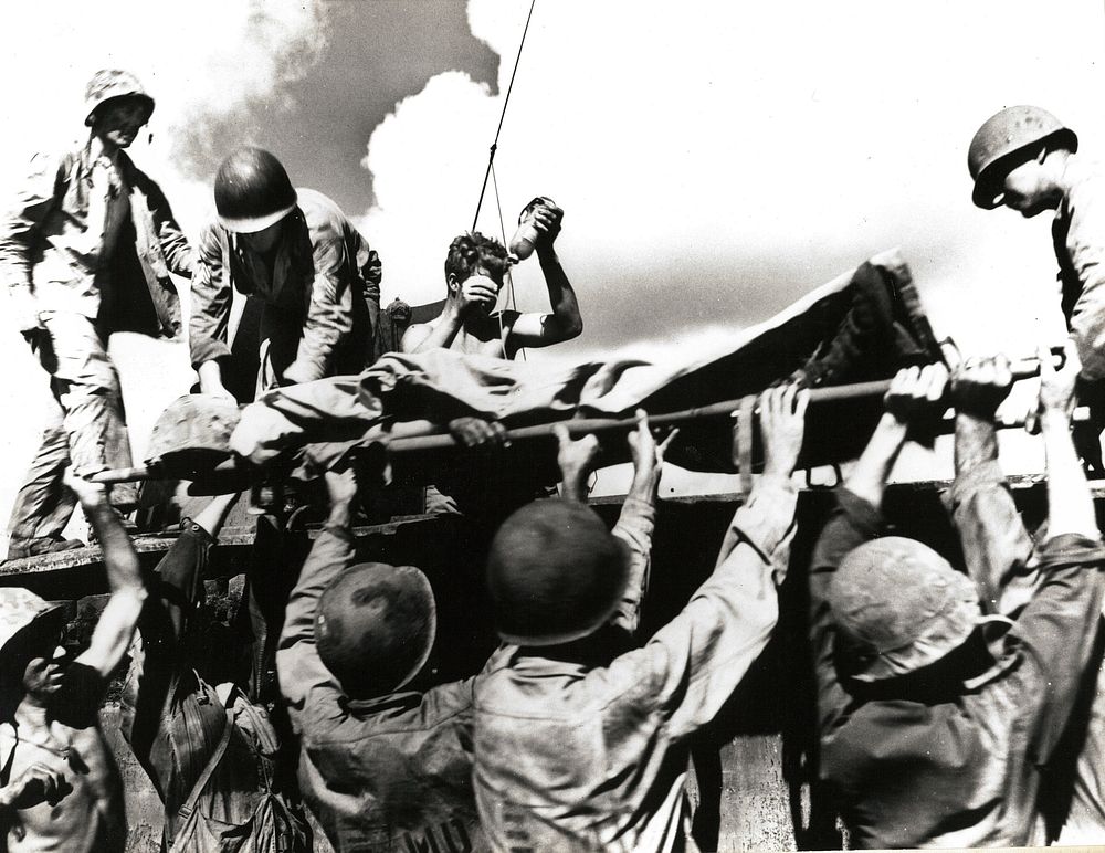 A wounded marine is placed aboard an LVT for evacuation from Tinian, July-August 1944. [World War II][Pacific campaigns]