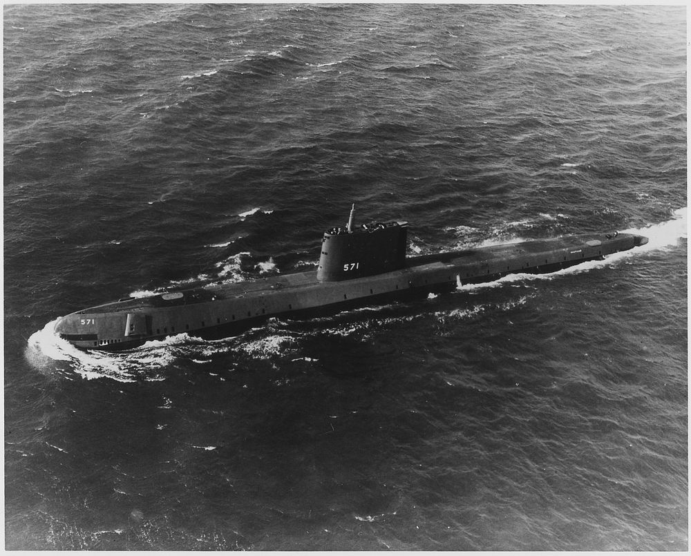 USS Nautilus (SS-571), the Navy's first atomic powered submarine, on its initial sea trials, 01/20/1955. Original public…