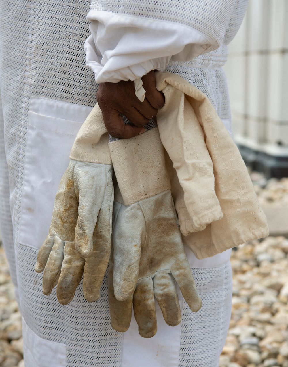Leslie Burk a retired USDA engineer and project manager for the people’s garden holds on to her protective gloves after…