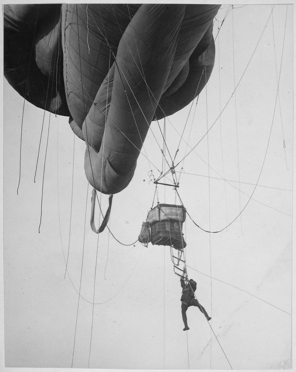 Returning from a U-Boat scouting party. Aerial naval observer coming down from a "Blimp" type balloon after a scouting tour…