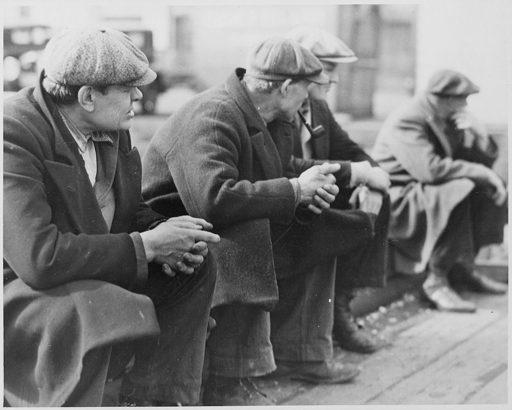 Row of men at the New York City docks out of work during the depression, 1934. Photographer: Hine, Lewis. Original public…
