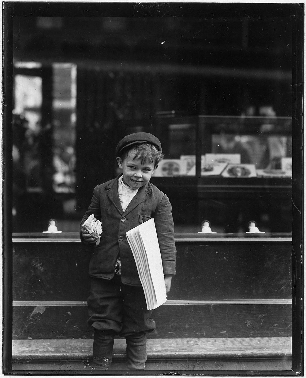 Tommy Hawkins, 5 years old. Sells papers. Is 41 inches high. St. Louis, Mo, May 1910. Photographer: Hine, Lewis. Original…