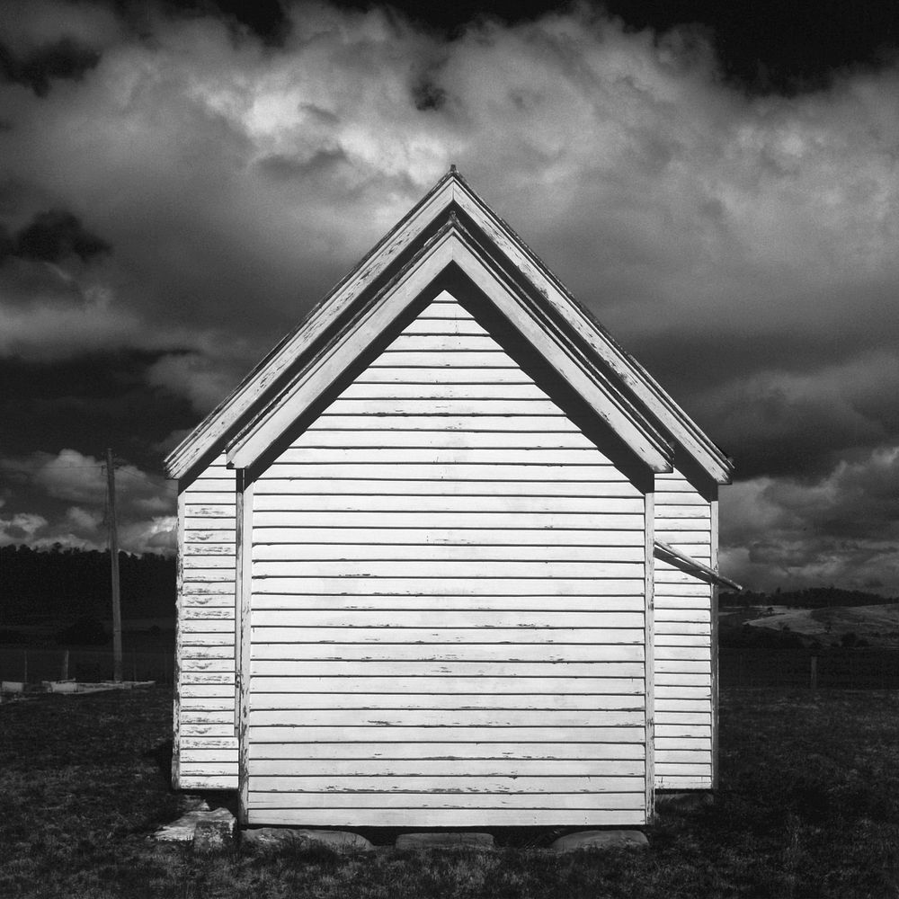 Symmetrical cabin, black & white photography. View public domain image source here