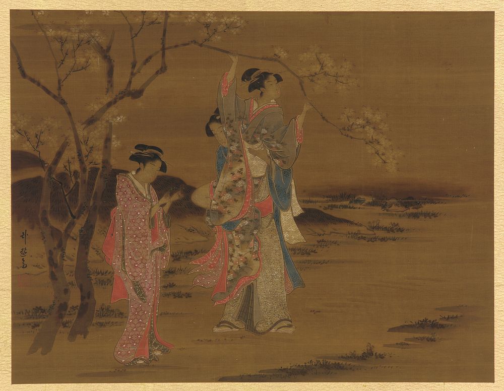Two girls and a man under a cherry tree