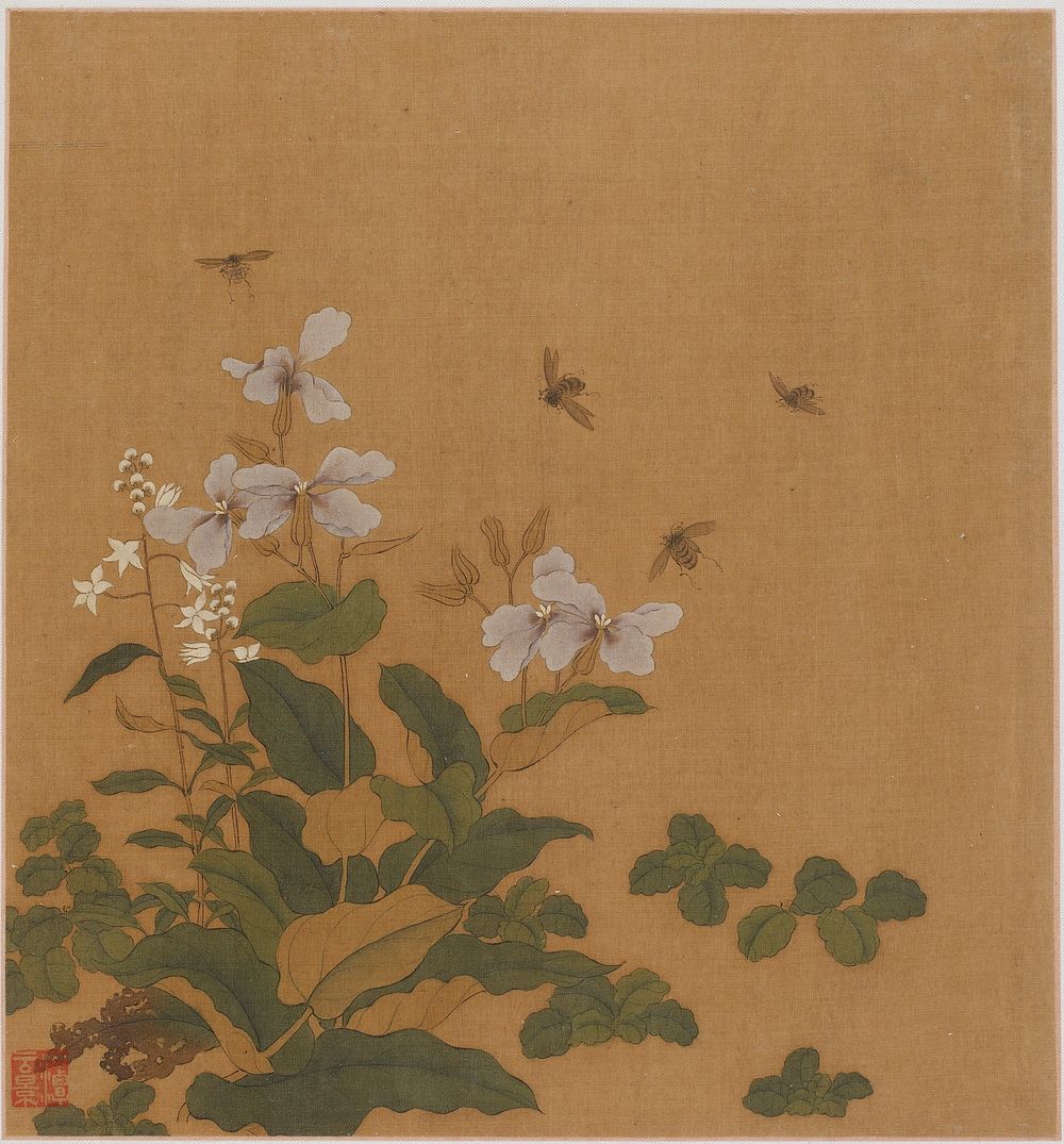 Bees hovering over flowers