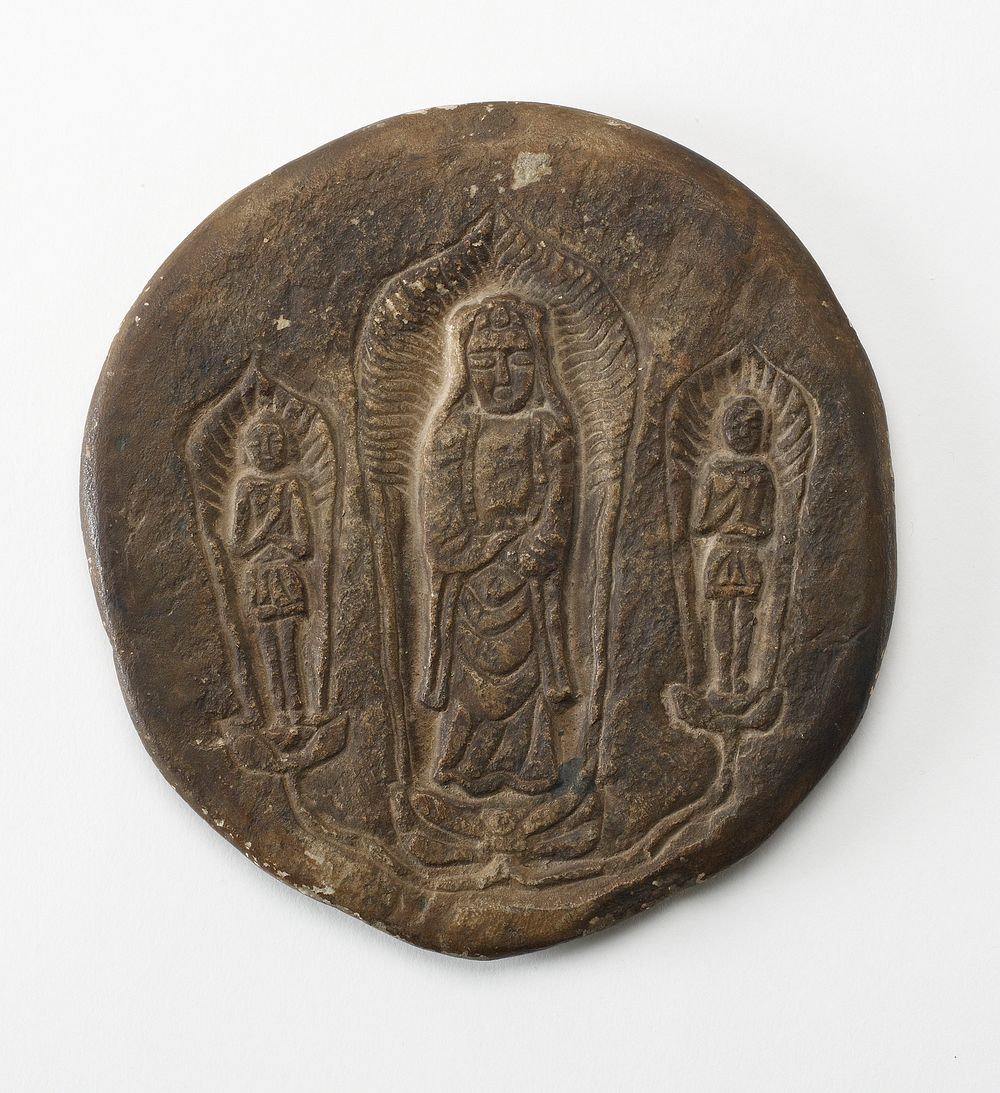 Circular plaque with Buddhist trinity on obverse and brief inscription on reverse