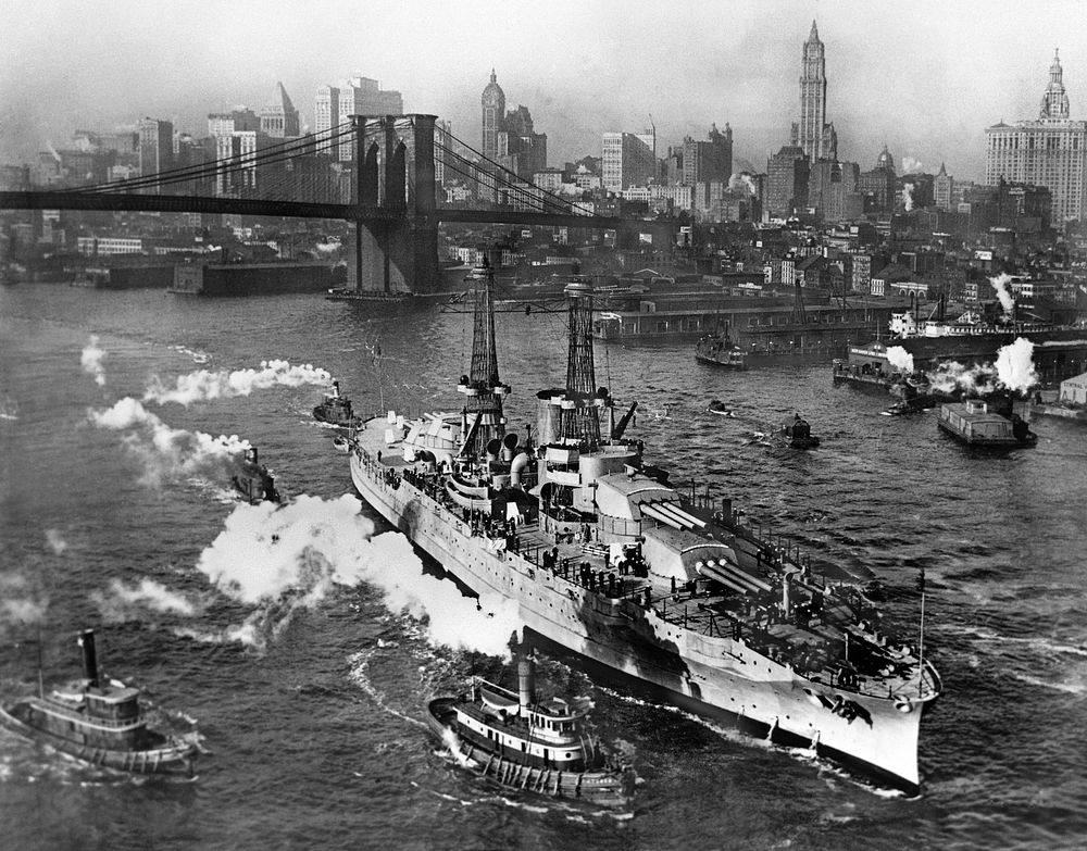 View of USS ARIZONA taken from Manhattan Bridge on the East River in New York City on its way back from sea trials. Note…