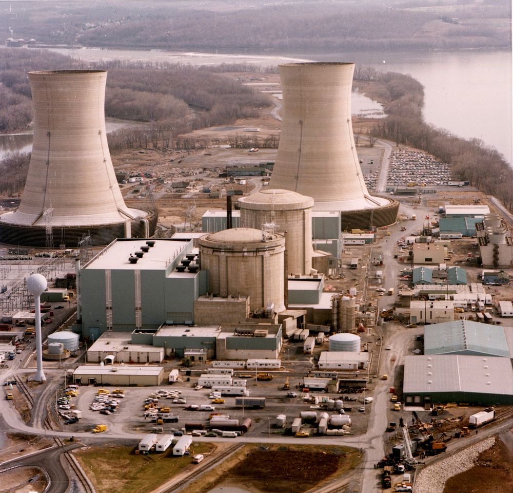 Color photograph of the Three Mile Island nuclear generating station, which suffered a partial meltdown in 1979. The…