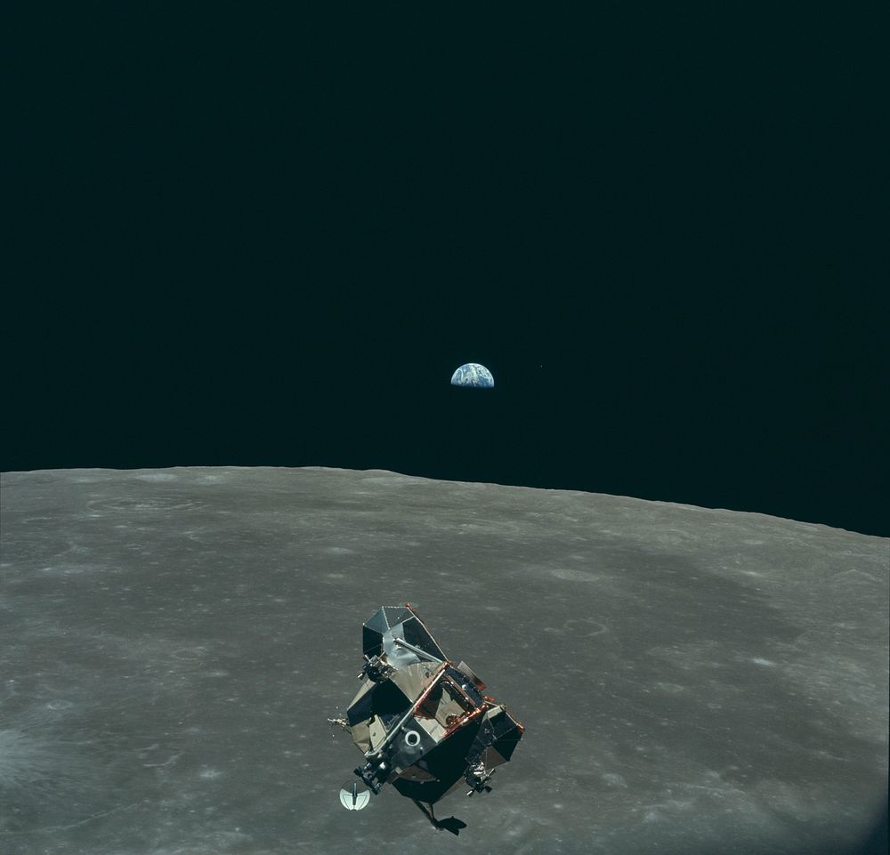 Earth, Moon and Lunar Module, in lunar orbit after return from the moon and before rendezvous with the Apollo 11…