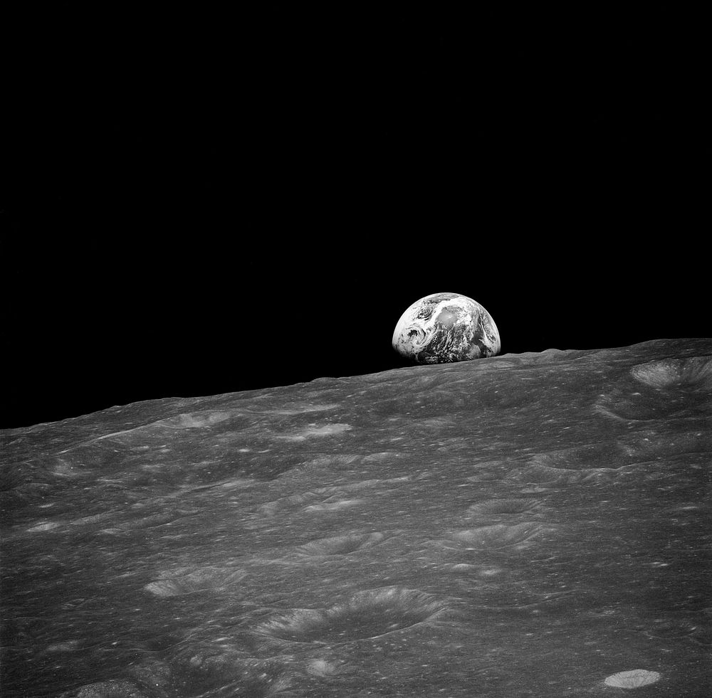 The first photograph taken by humans of Earthrise during Apollo 8.