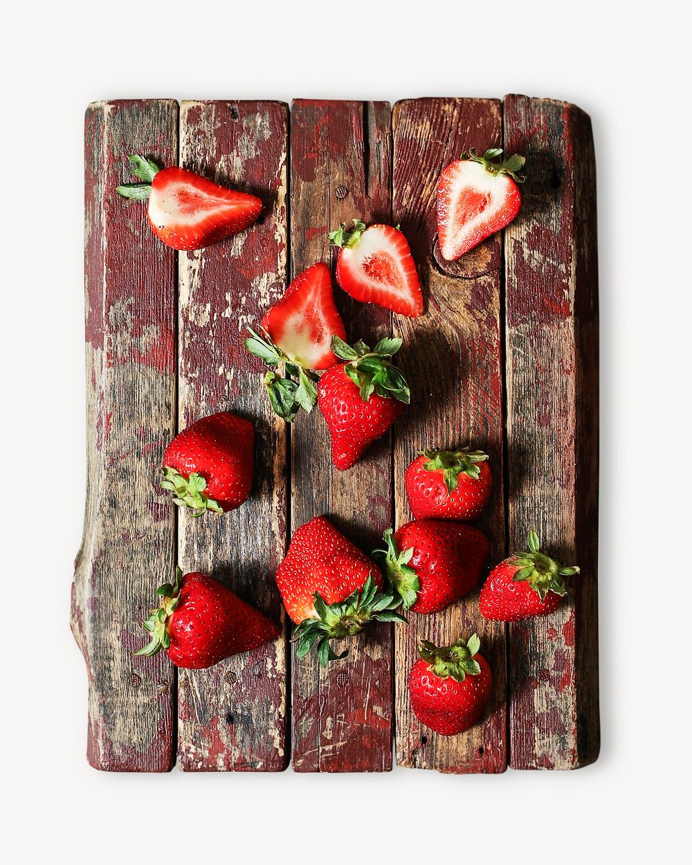 Freshly cut strawberries on a wooden board psd