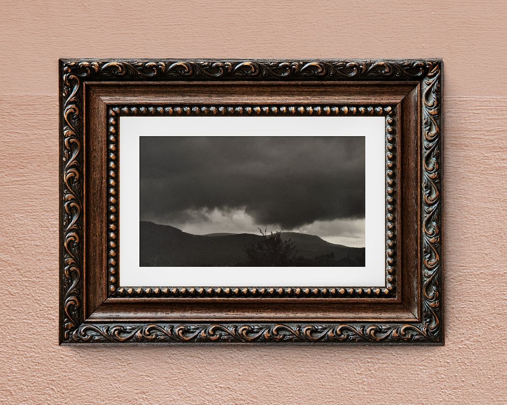Dark cloud landscape, brown frame