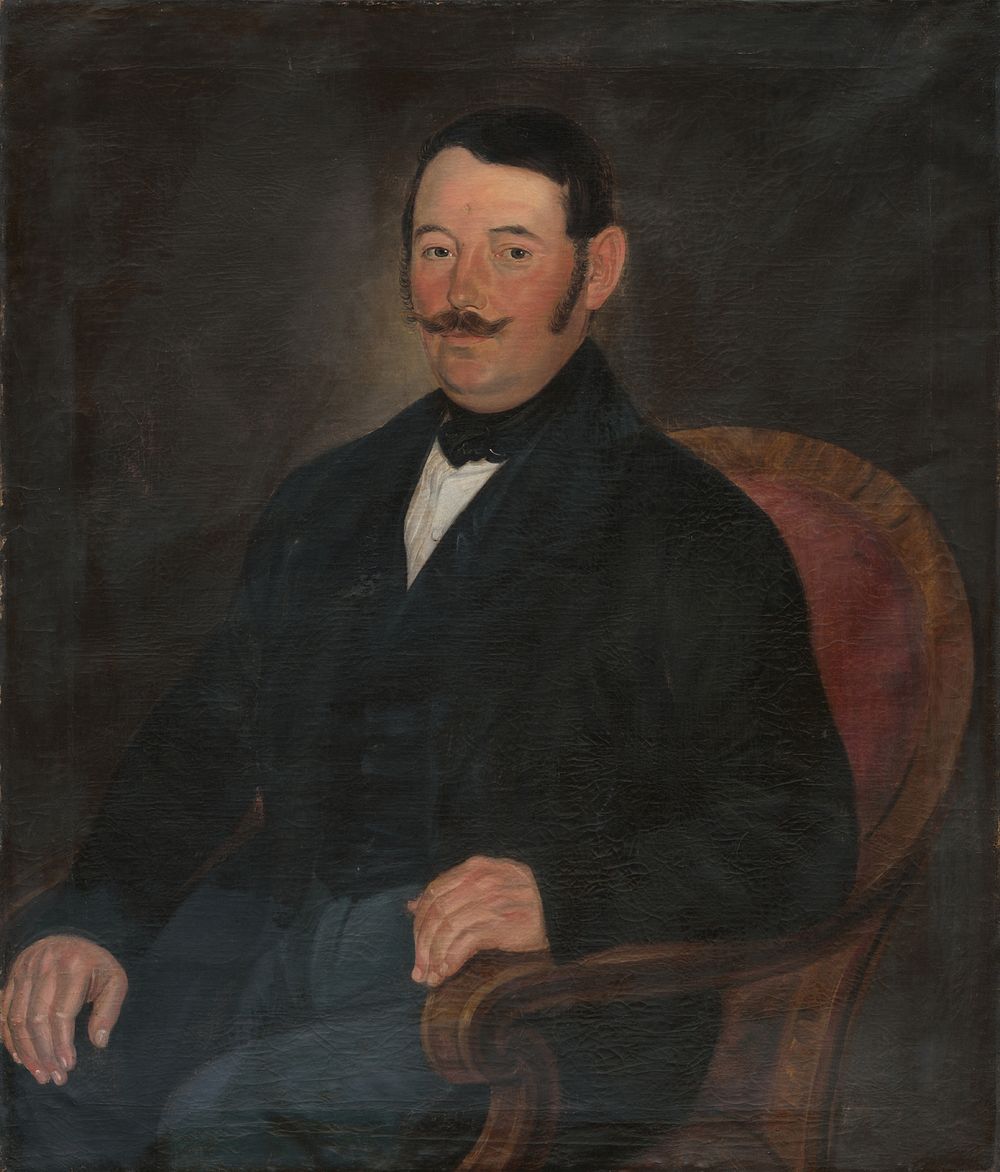 Portrait of a man in a chair