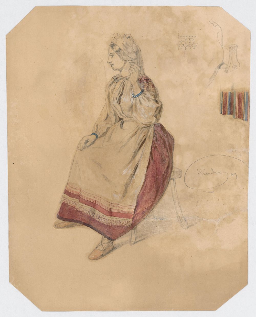 Seated young woman in a folk costume