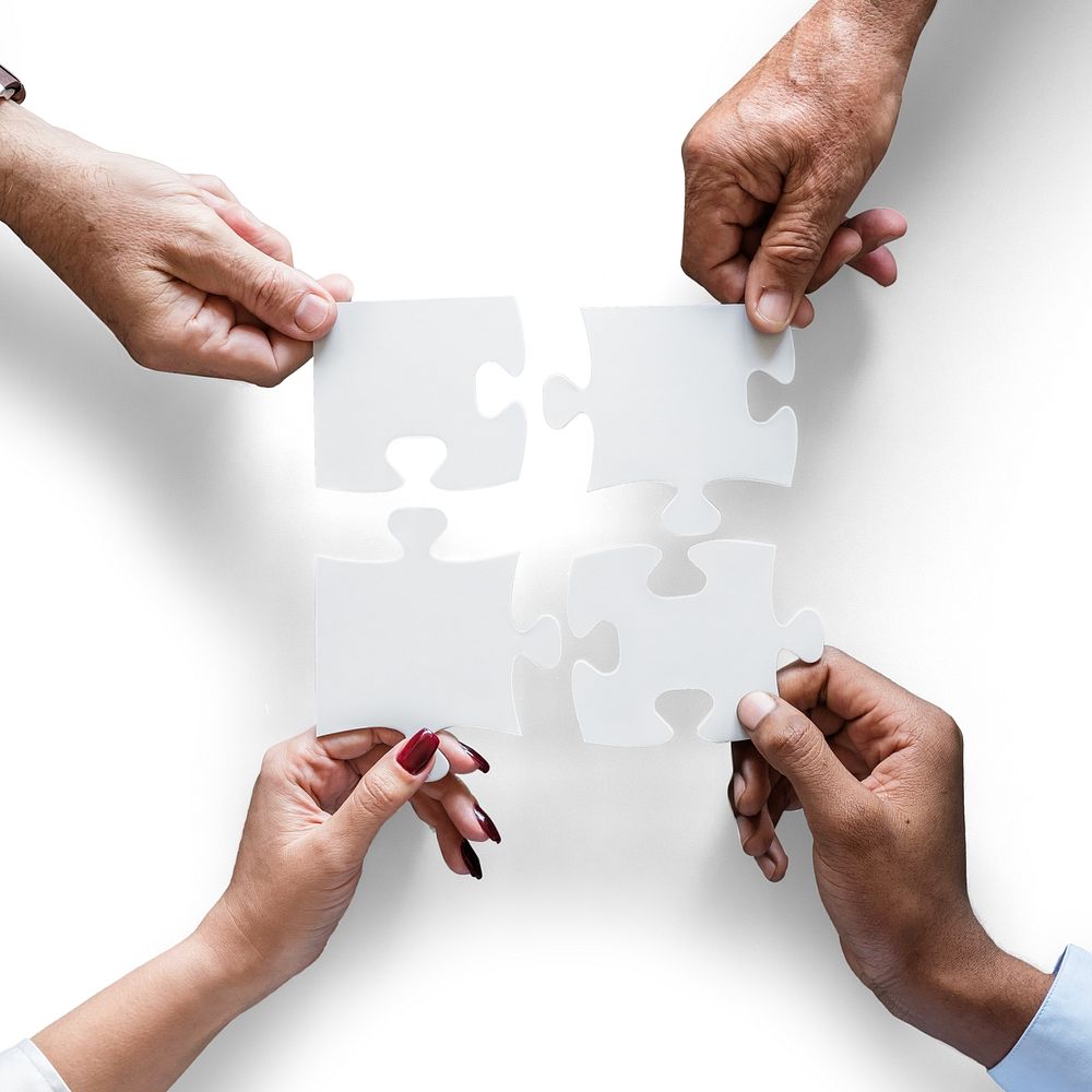 Hands holding puzzle isolated image