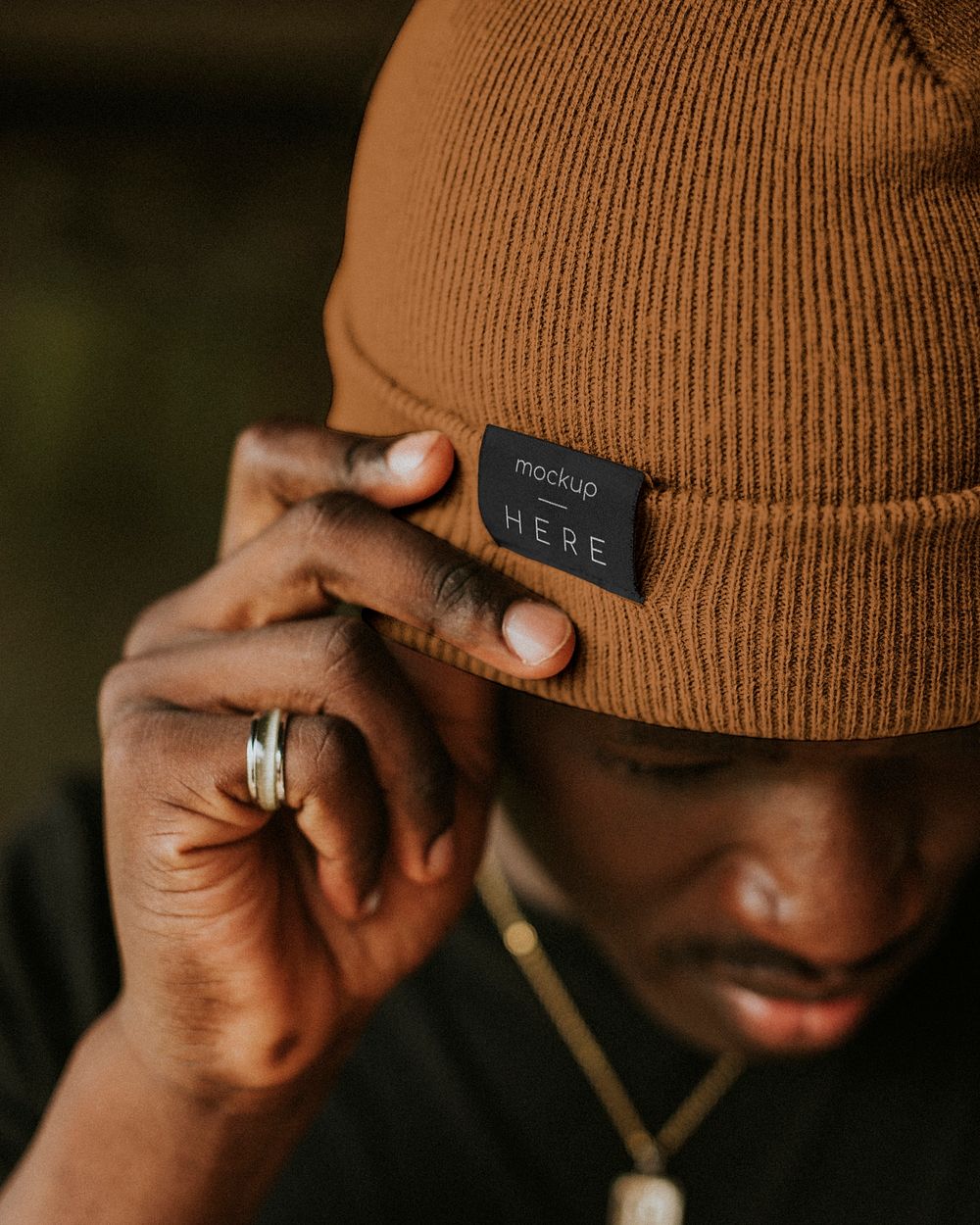 Tan brown woolen hat mockup psd on African American male model