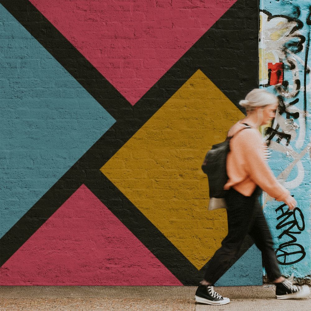 Wall mockup psd with a woman walking past