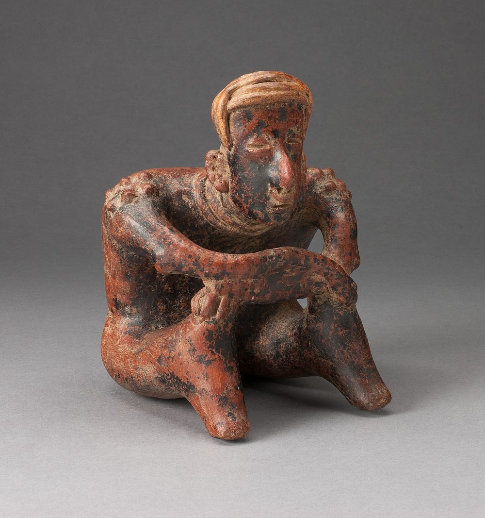 Seated Male Figure Leaning Forward with Arms Crossed over Knees by Nayarit