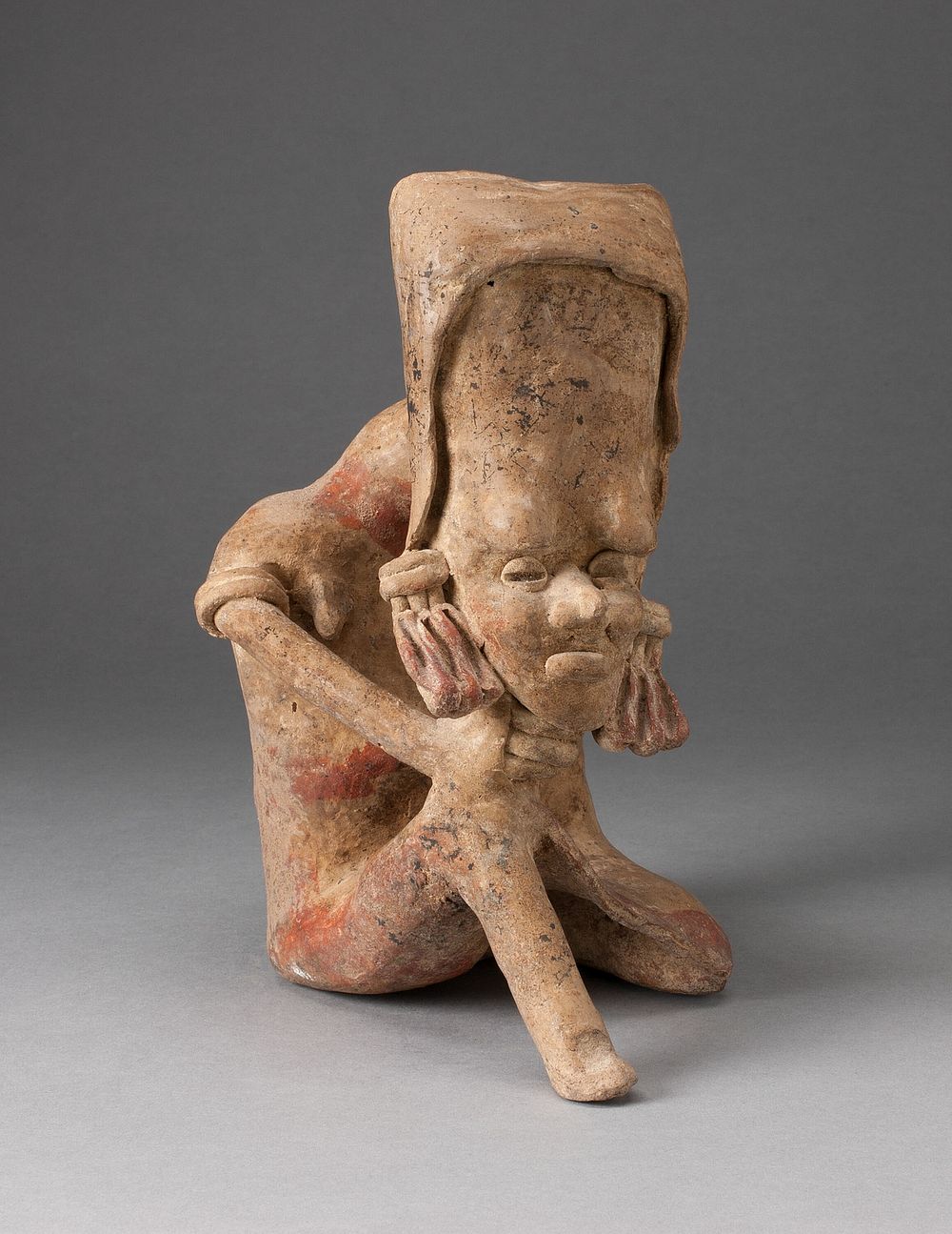 Seated Figure with an Elongated Head and Chin Placed on Knee by Jalisco