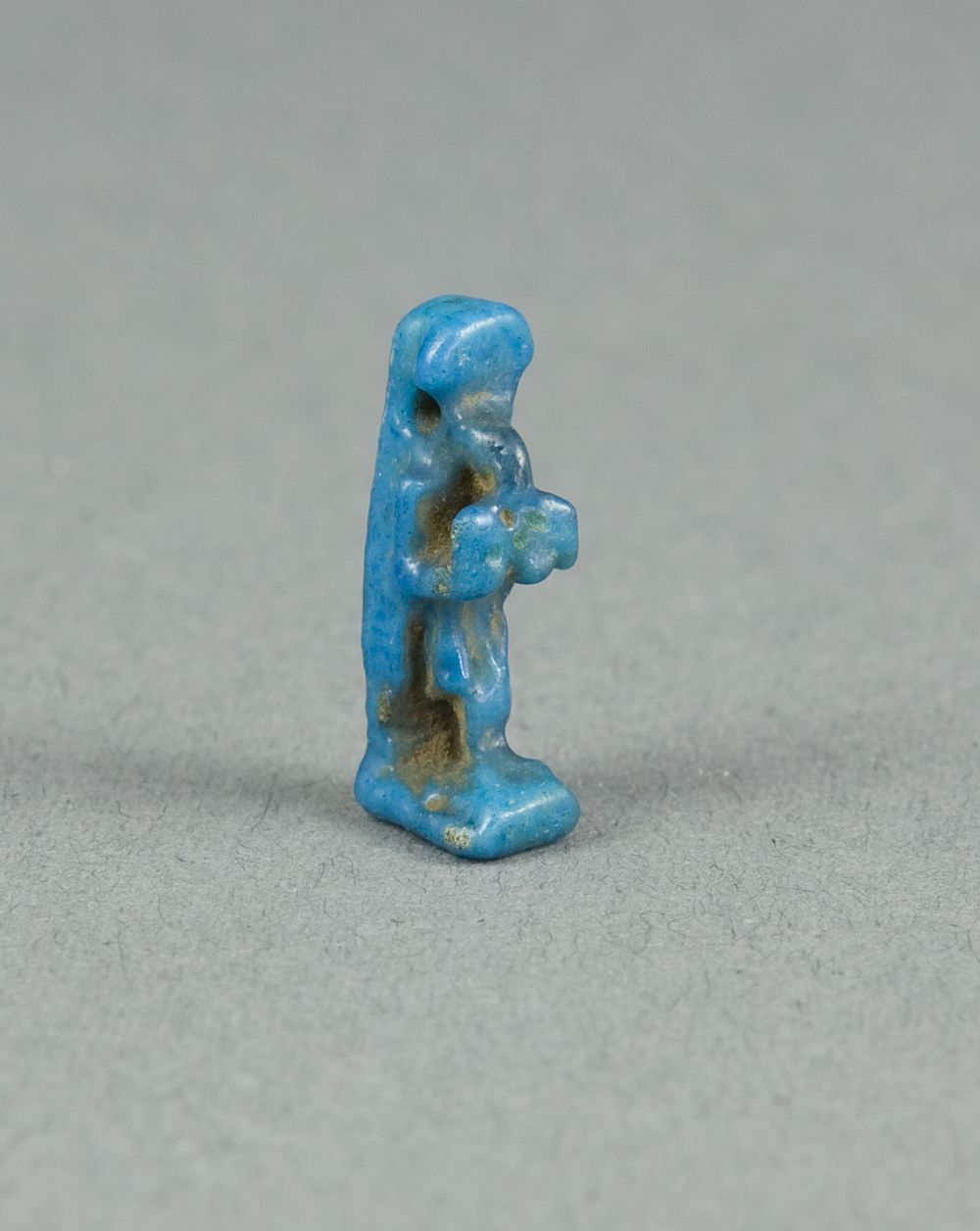 Amulet of the God Thoth Holding an Offering Table (?) by Ancient Egyptian