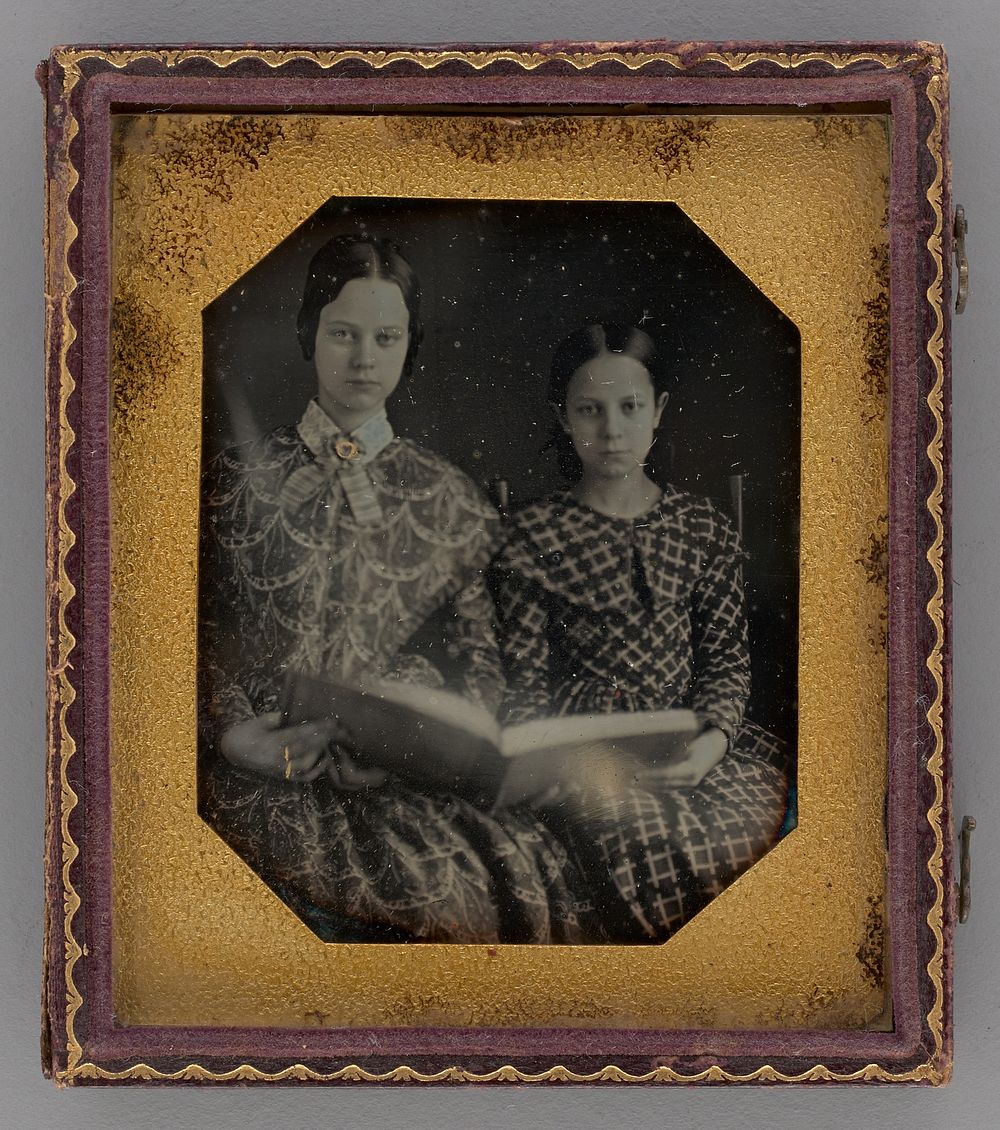 Untitled (Portrait of Seated Two Girls Holding a Book) by Unknown Maker