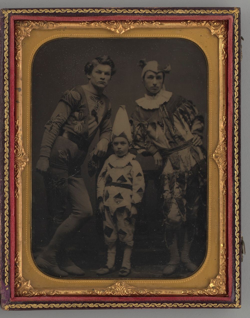 Untitled (Portrait of two Men and one Boy, Dressed in Clown Costumes)