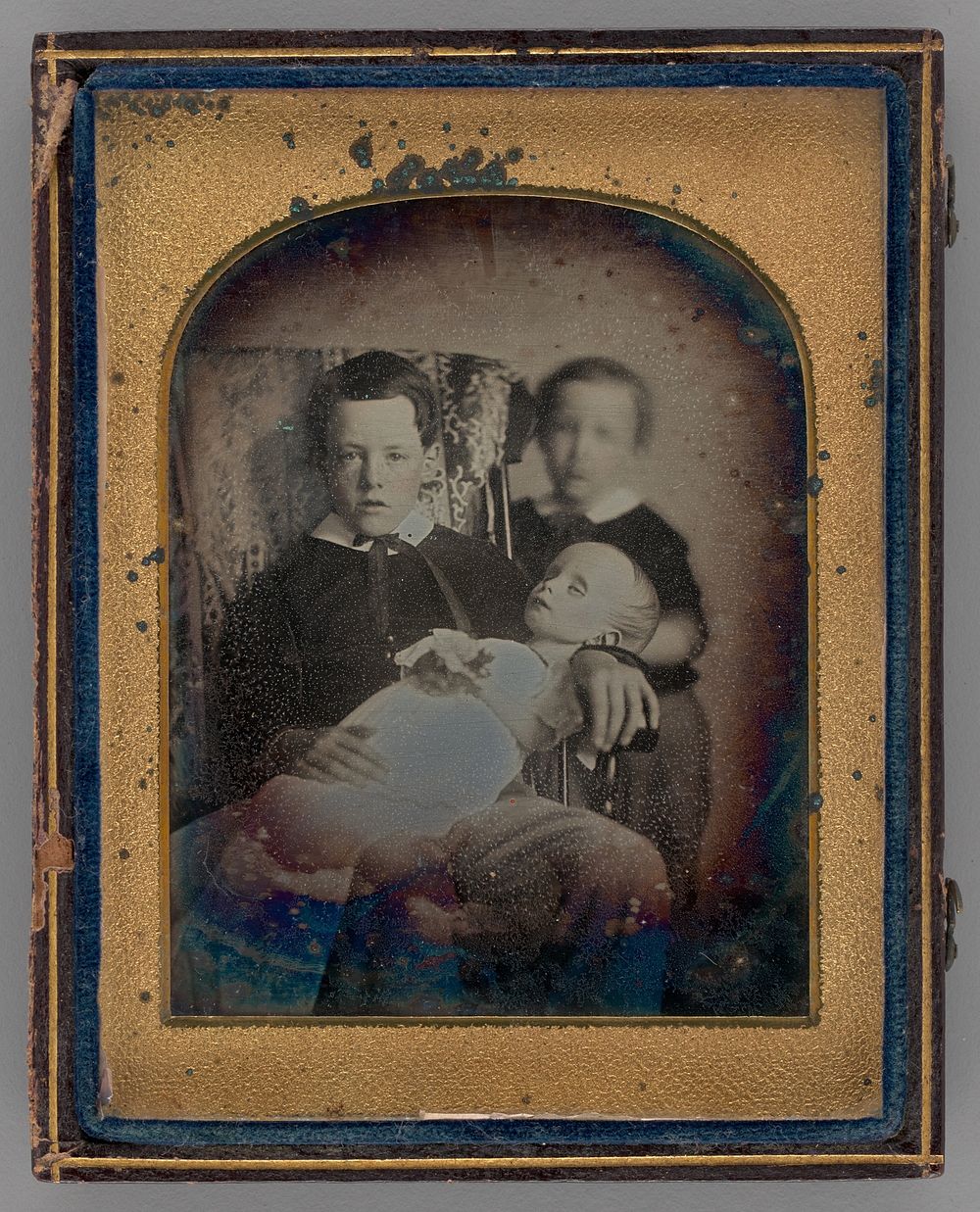 Untitled (Two Boys Holding a Deceased Baby)