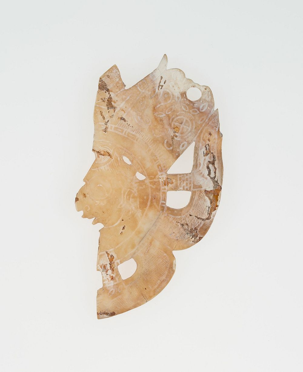 Carved Shell Depicting the Profile Face of Diety (Broken) by Maya
