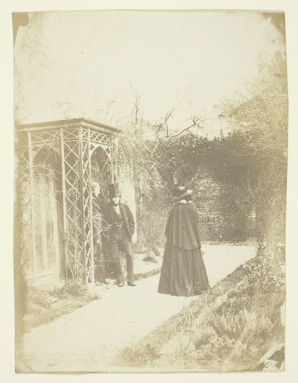 Unidentified Woman and Two Men Standing Outdoors by Unknown