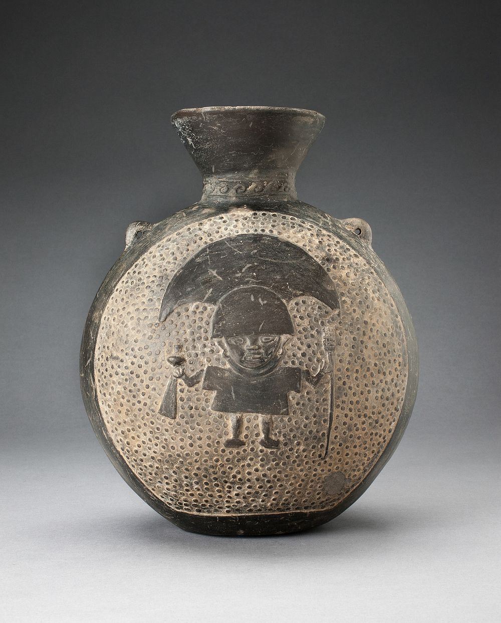Jar with Relief of Standing Figure with Crescent Headdress, Holding Ritual Objects by Chimú