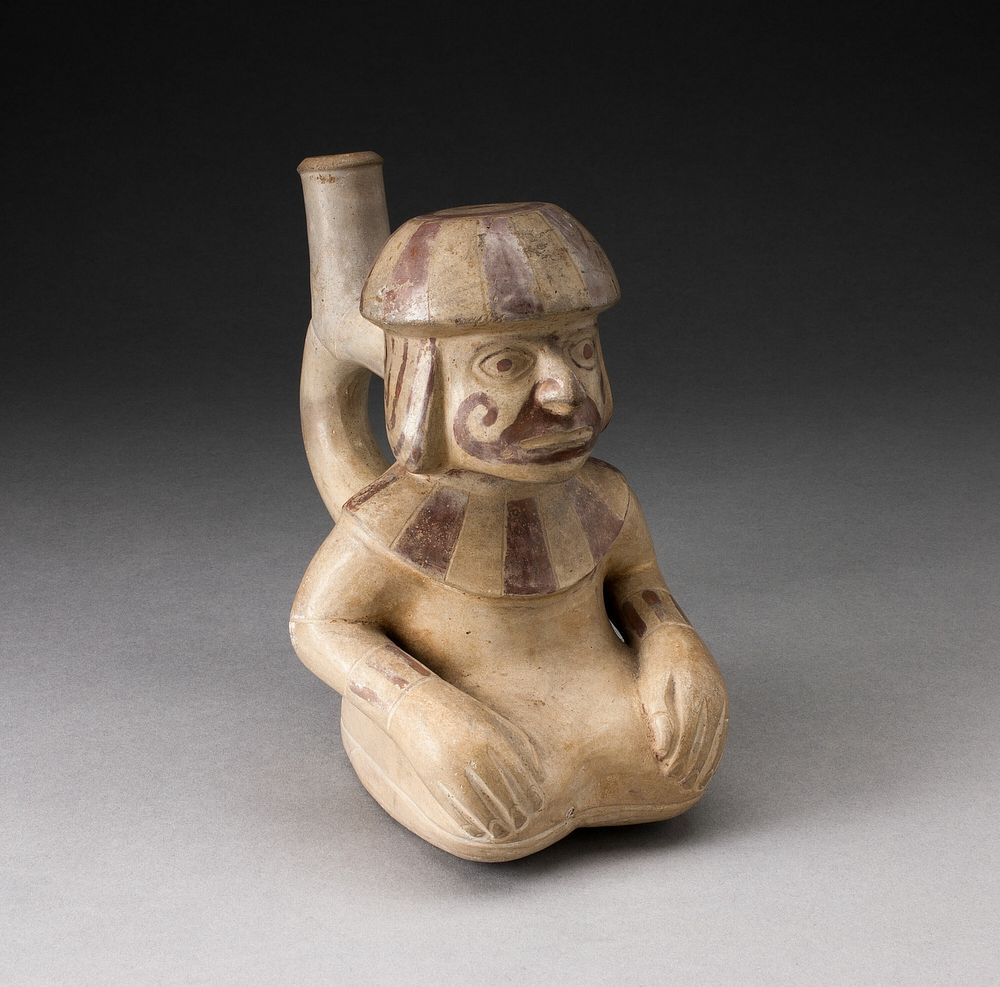 Handle Spout Vessel in the Form of Seated Man with Tatooed or Painted Face by Moche