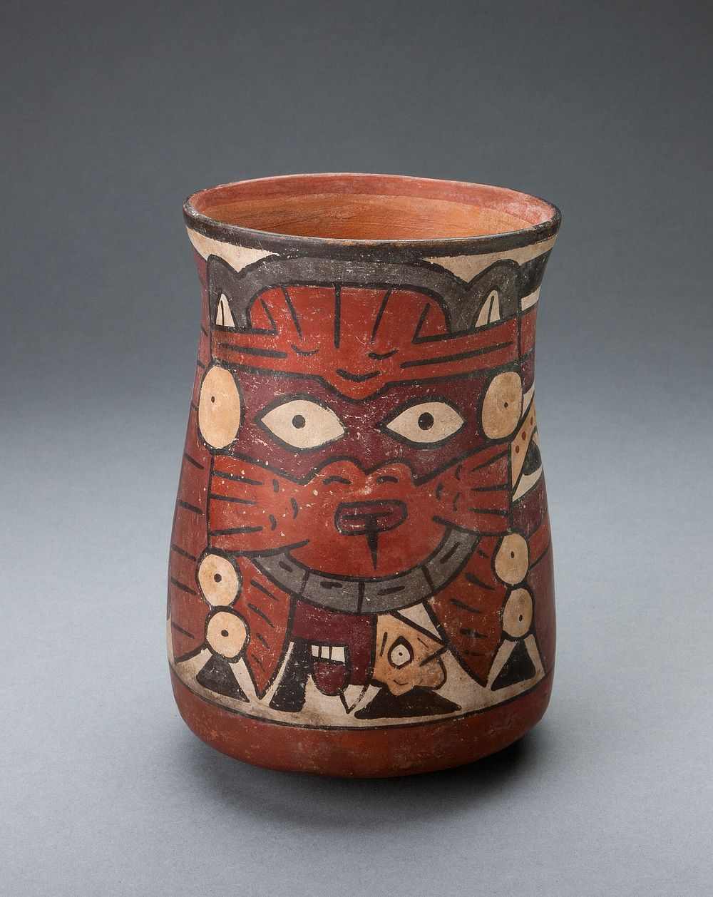 Beaker Depicting a Costumed Performer Holding Decapitated Head by Nazca