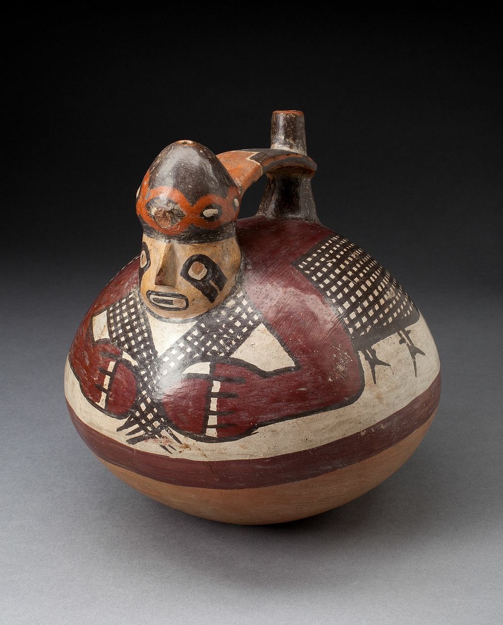 Single Spout Vessel in the Form of a Figure Holding a Fishing Net by Nazca