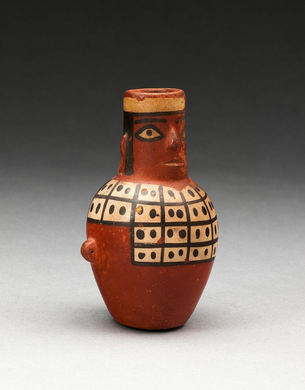 Miniature Jar in the Form of a Figure Wearing a Tunic by Tiwanaku