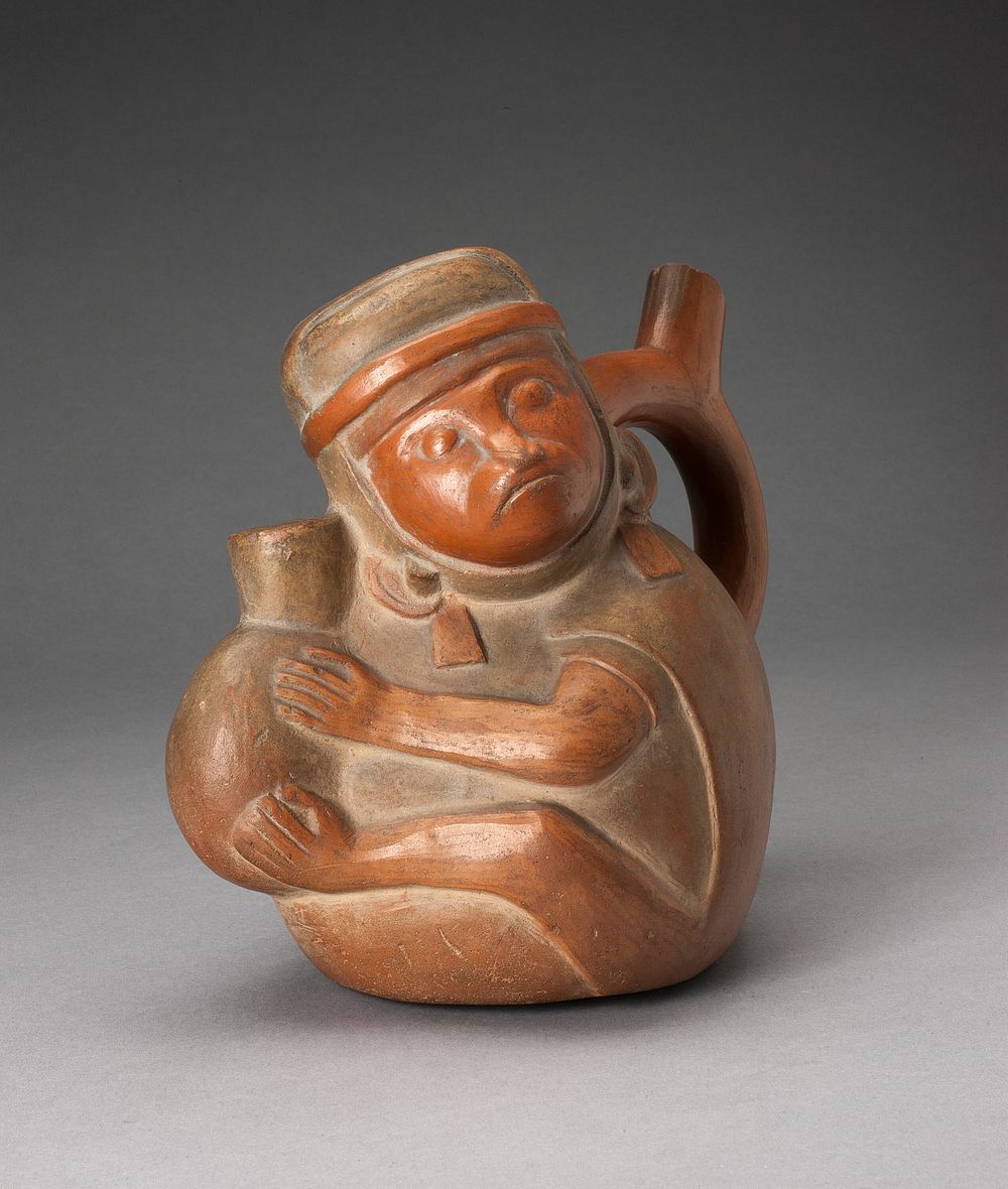 Handle Spout Vessel in the Form of a Monkey Holding a Jar by Moche