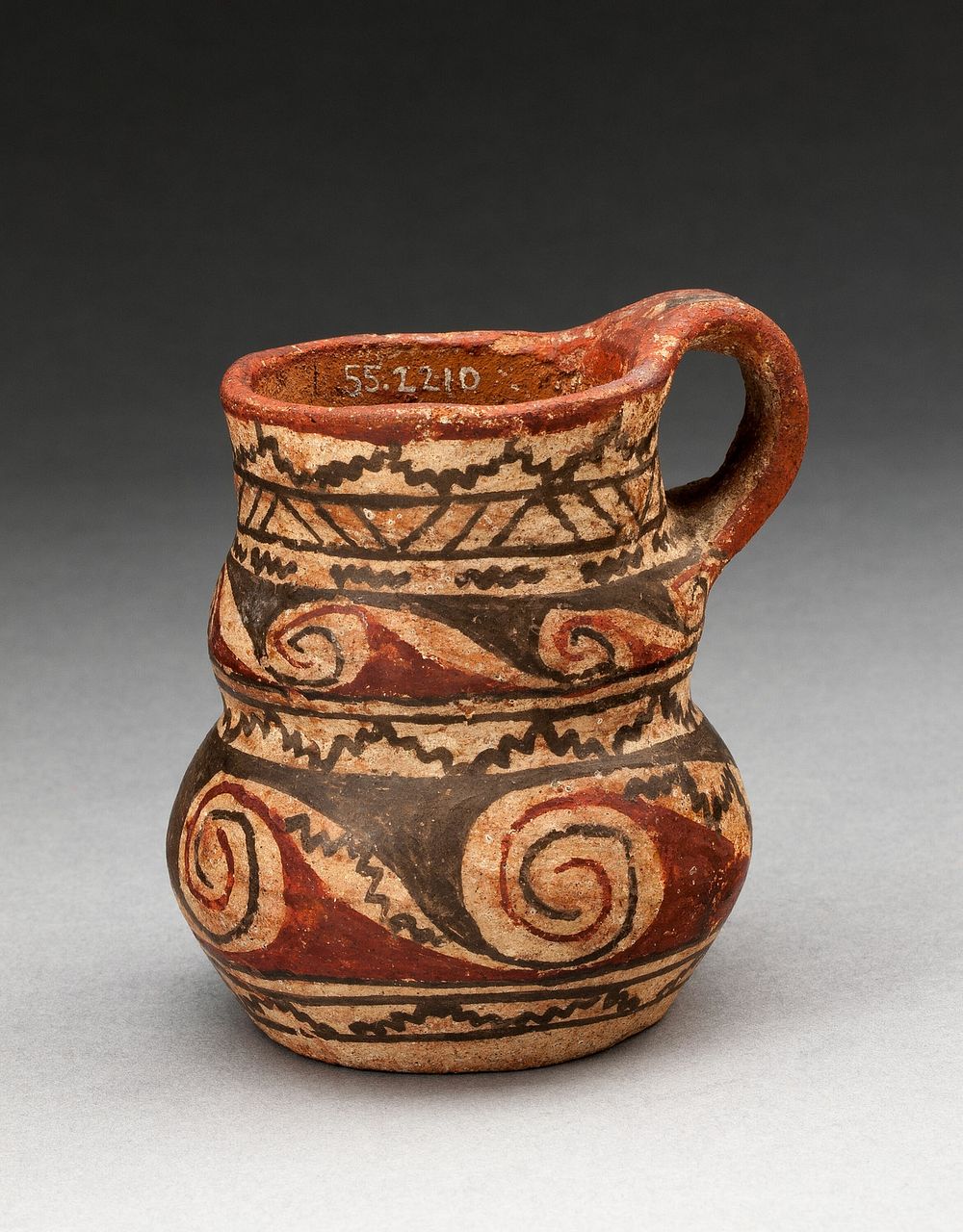 Miniature Handled Jug with Spiral and Zigzag Motifs by Tiwanaku