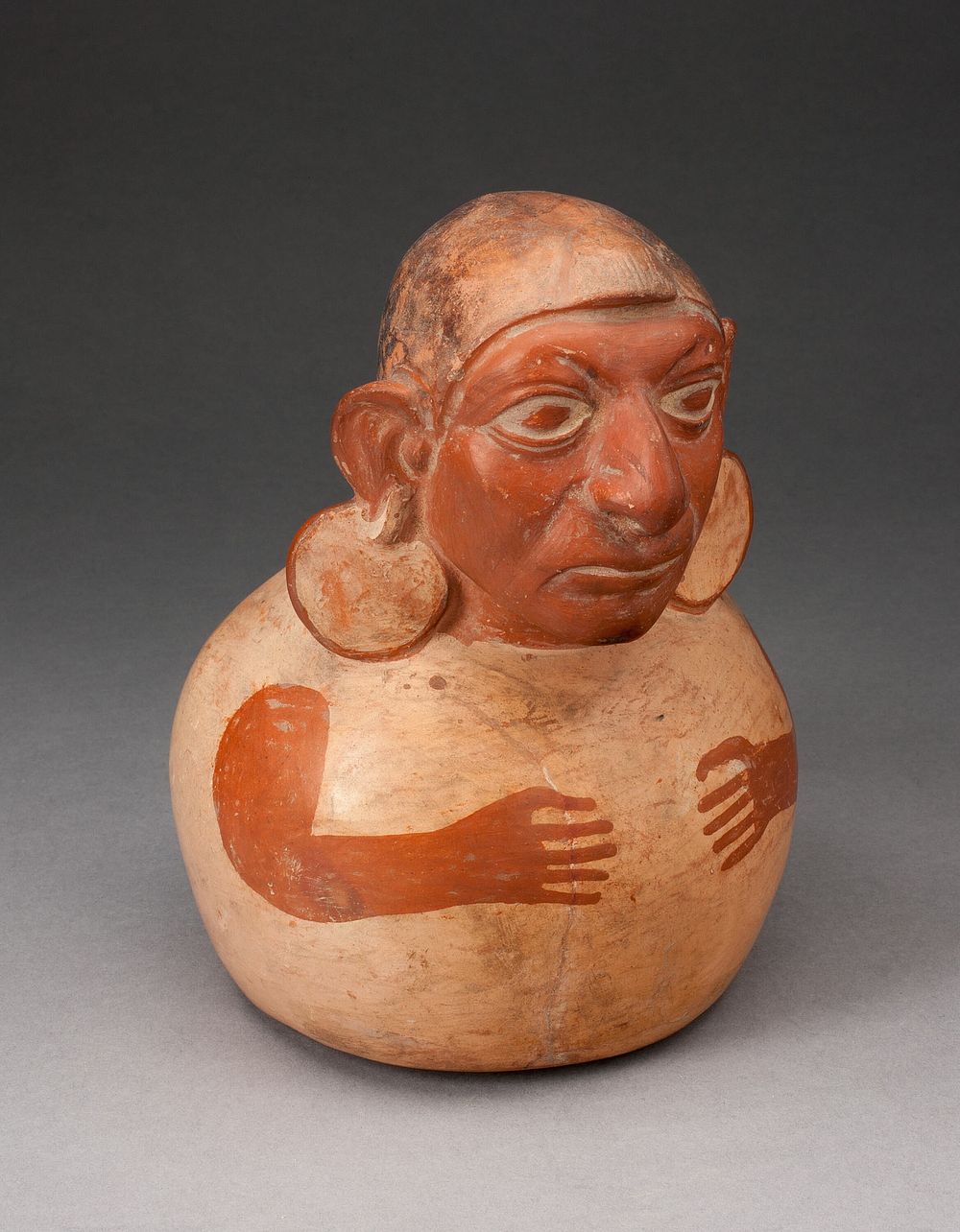 Handle Spout Vessel in the Form of a Figure with Modeled Head, Spout Missing by Moche