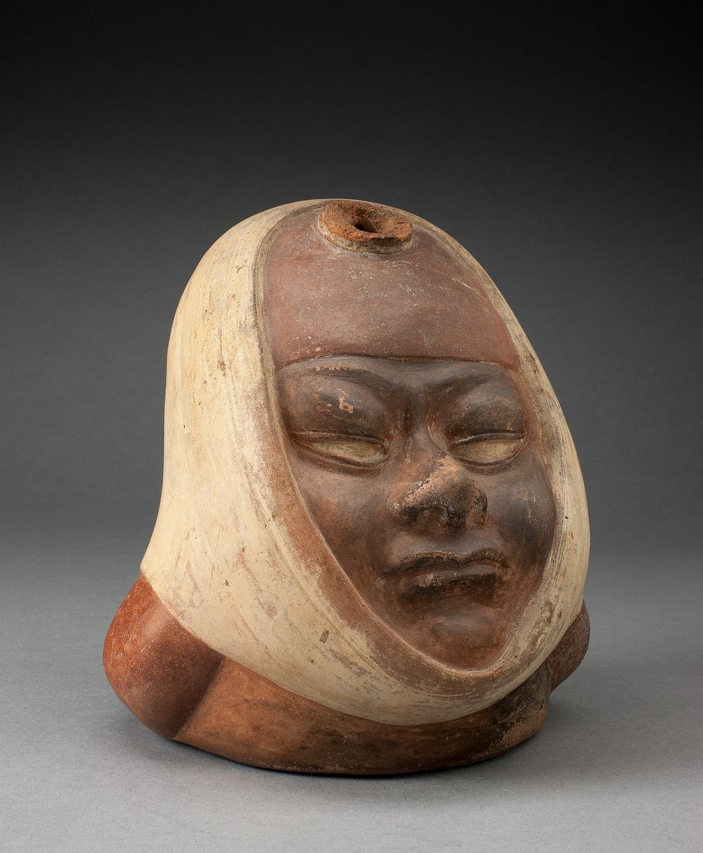 Stirrup Spout Vessel with Missing Handle in the Form of a Head Wraped in Textile by Moche