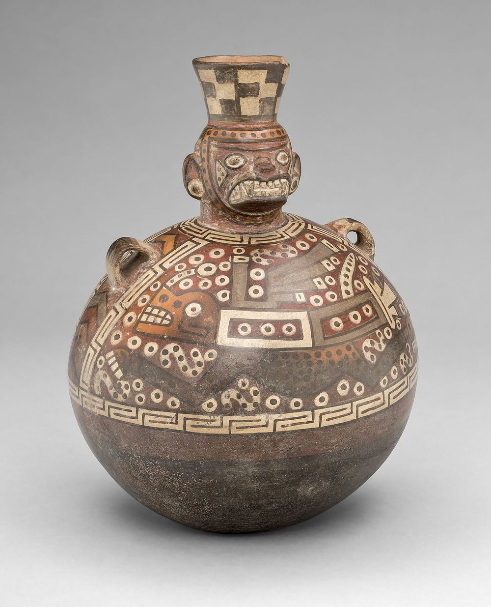 Bottle with a Masked Figure and Abstract Feline and Textile Motifs by Tiwanaku
